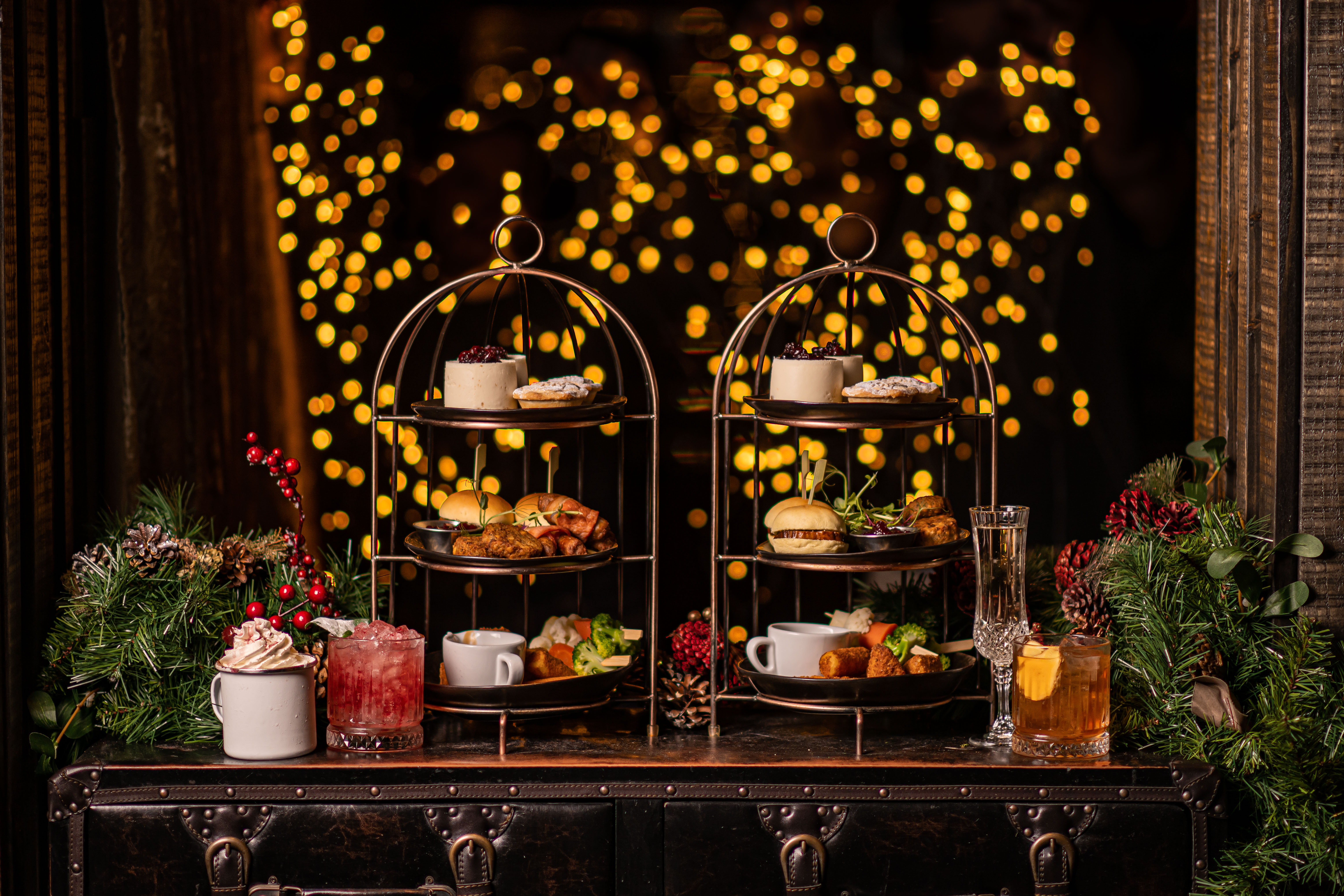 Tasty food, cocktails, and other drinks over a table