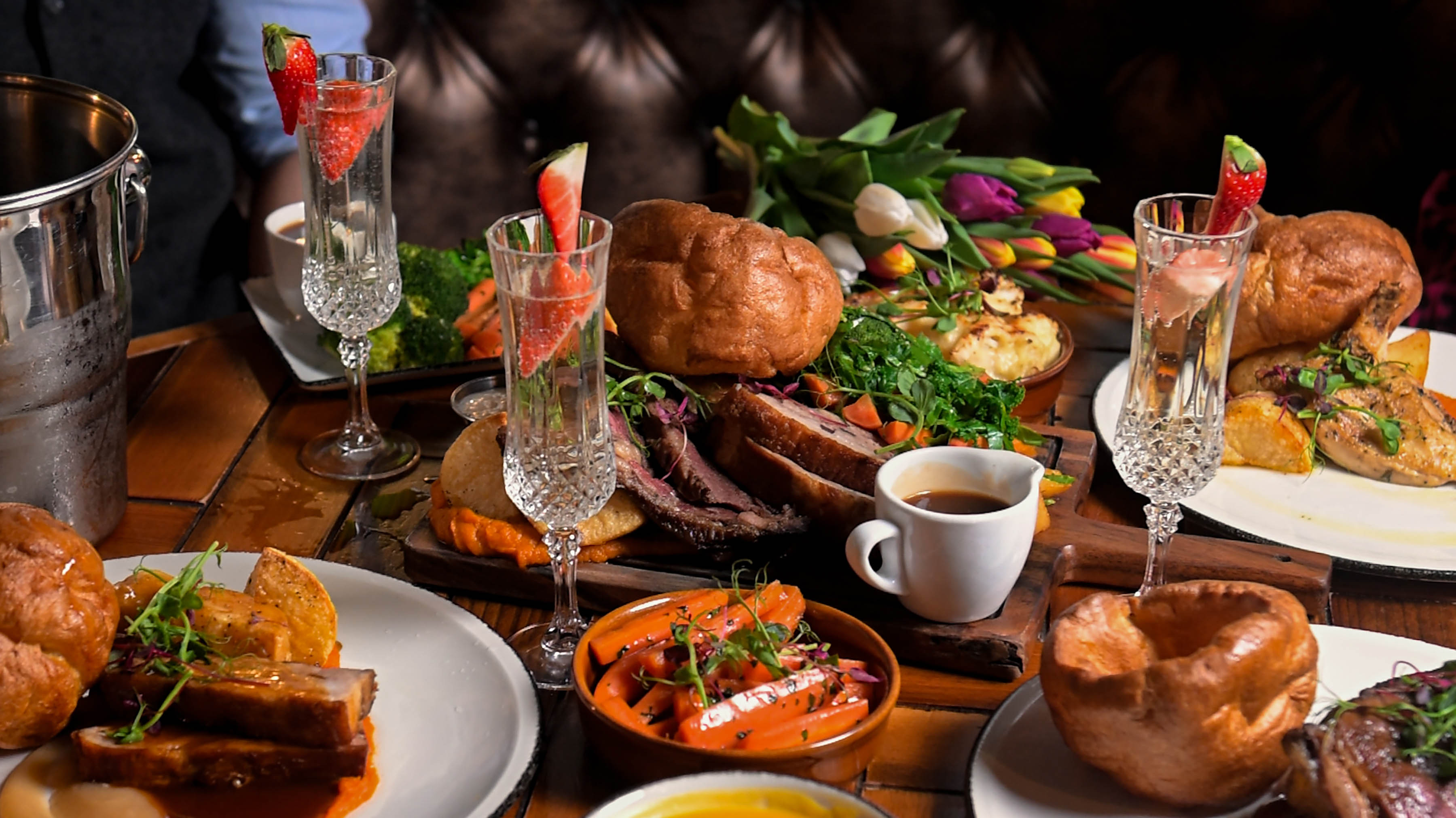 A variety of dishes on a table during sunday roast